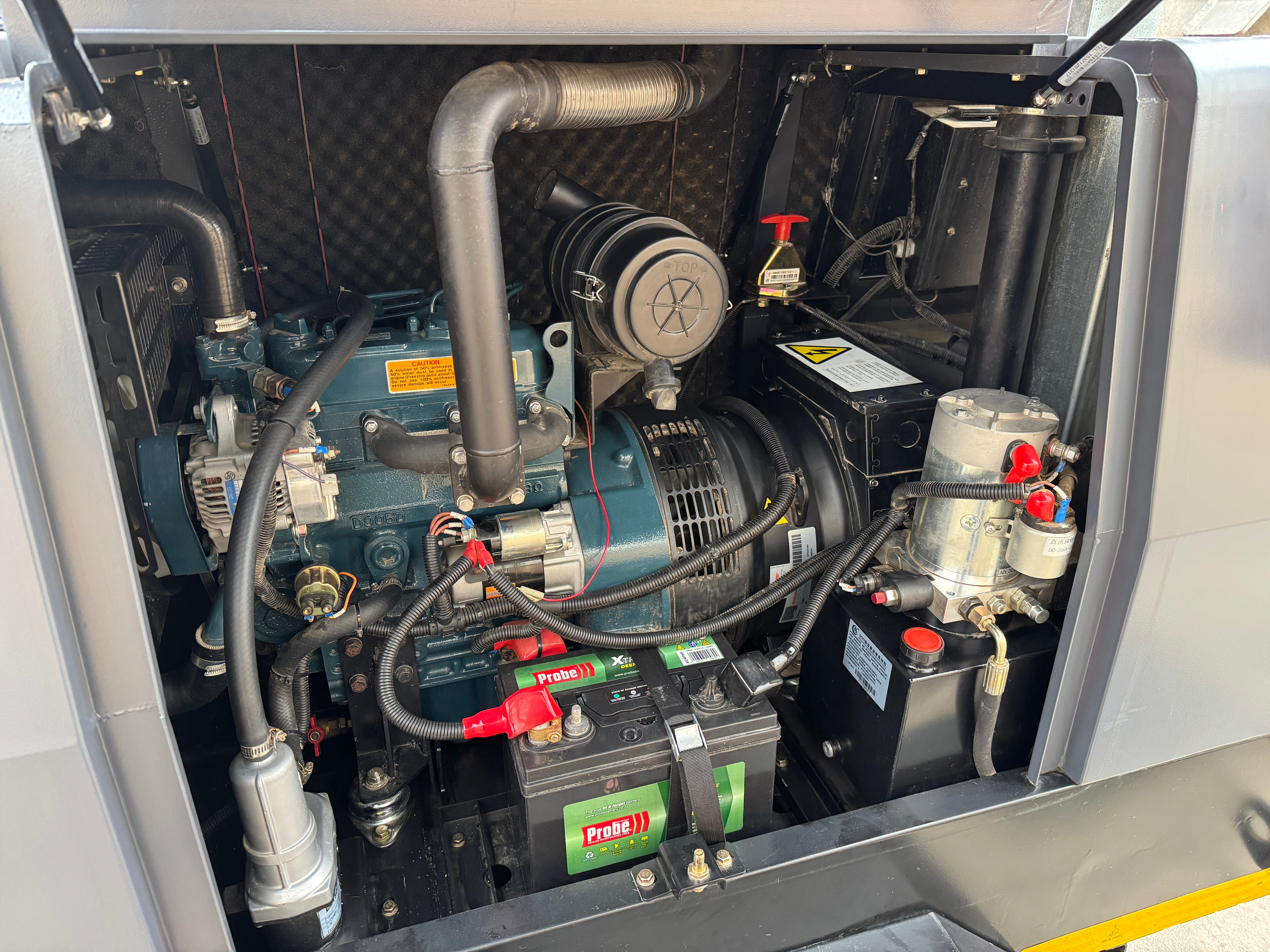 Hydraulic controls and trailer chassis of a Bundu Power demo lighting tower.